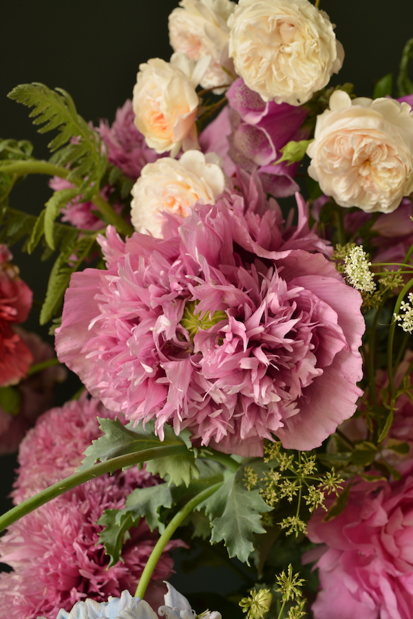 detail of pink bouquet with roses and peonies