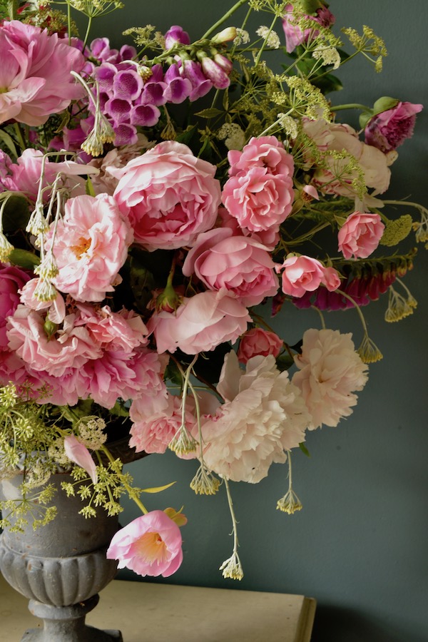 pink bouquet in grey urn