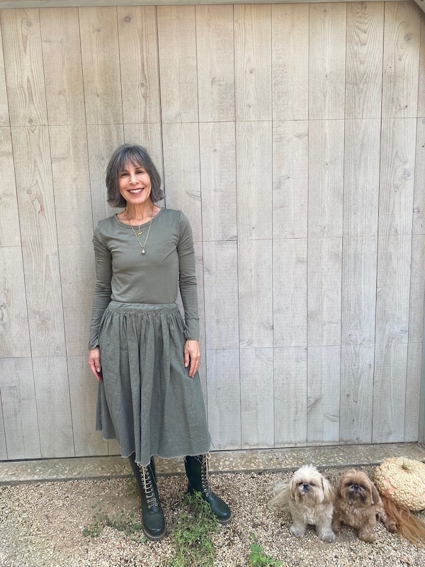 women in grey top and skirt