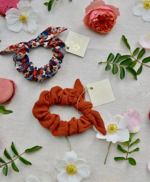 a terracotta-colored and patterned scrunchie