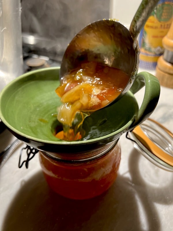 pouring jam into pots