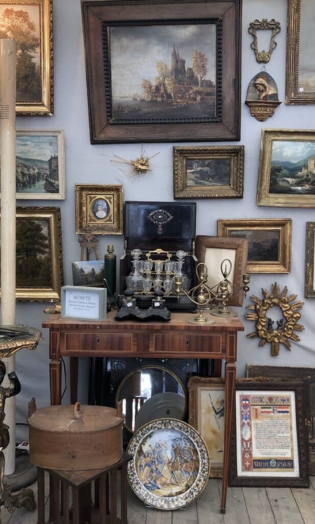 paintings displayed at a french antique dealer