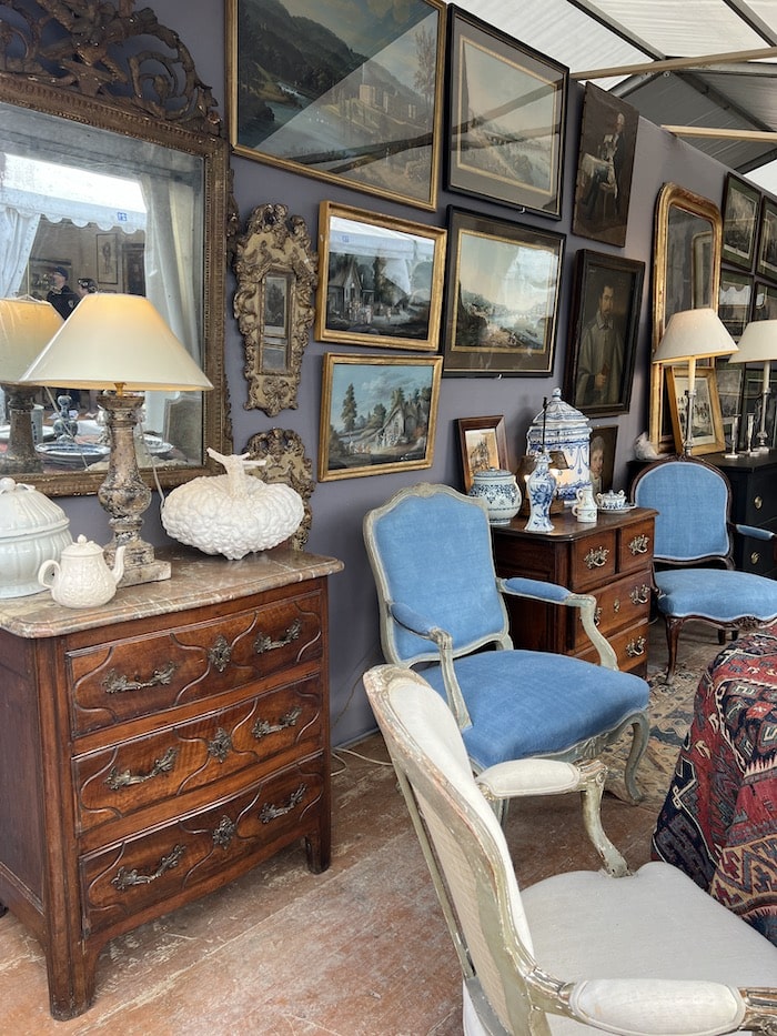 antique dealer in france with furniture and paintings